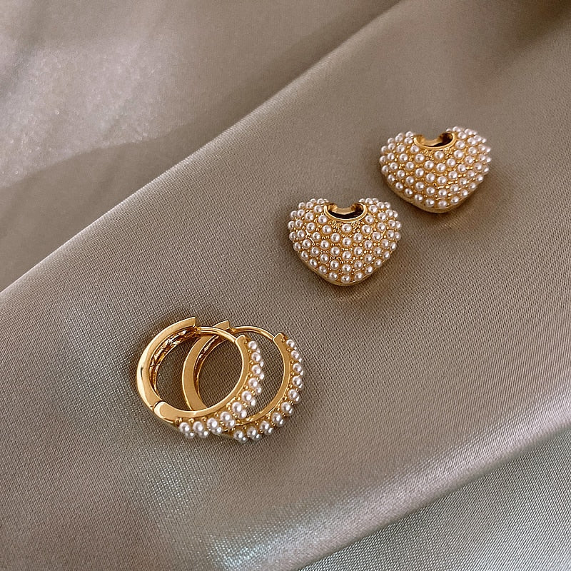 Gold flower-shaped earrings with cubic zirconia